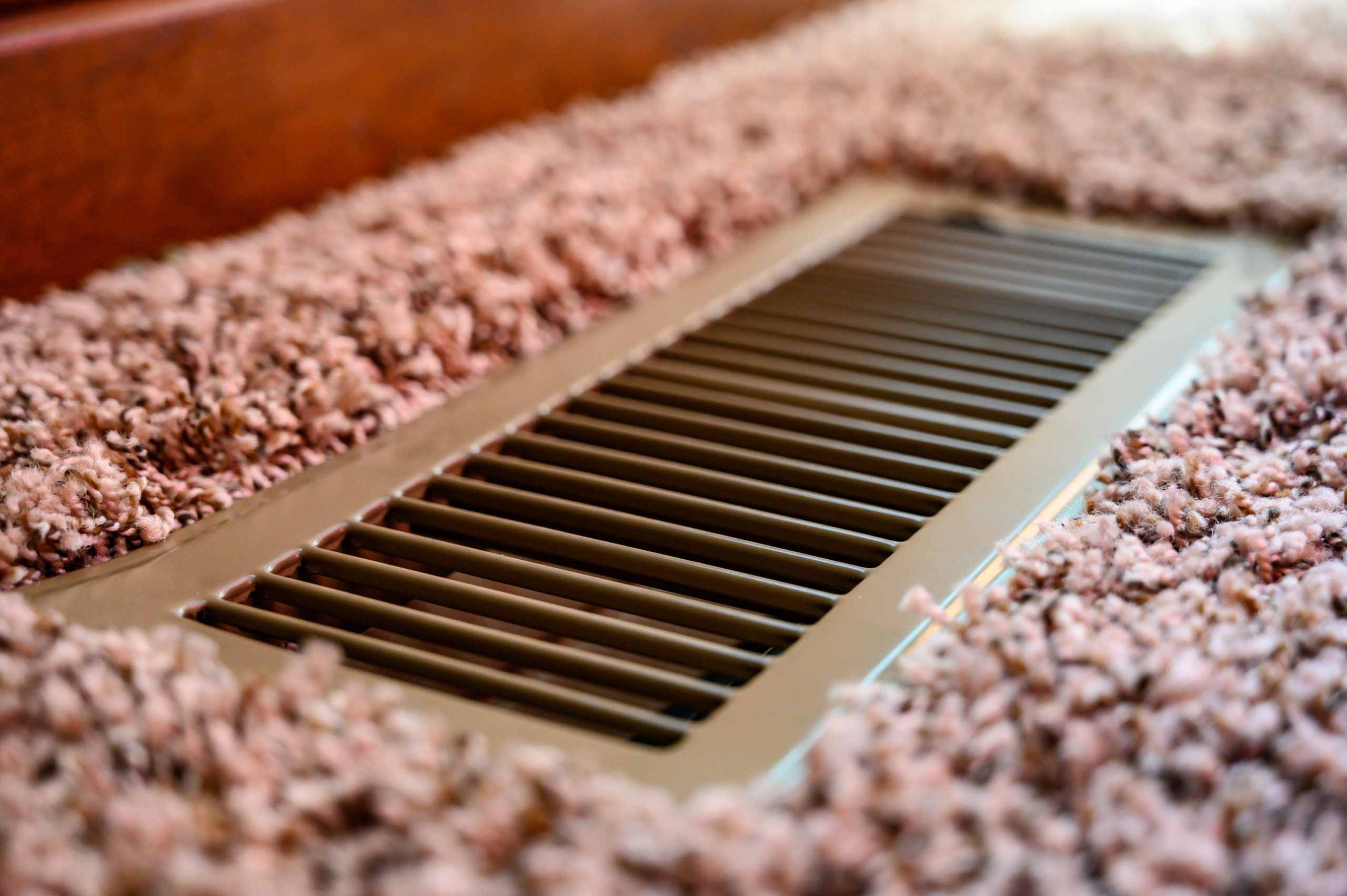 Ducted heater in a floor after a repair by a ducted heating service company