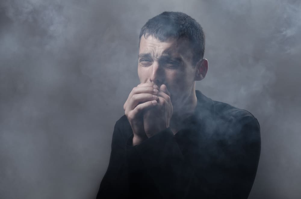 man-coughing-from-smoke