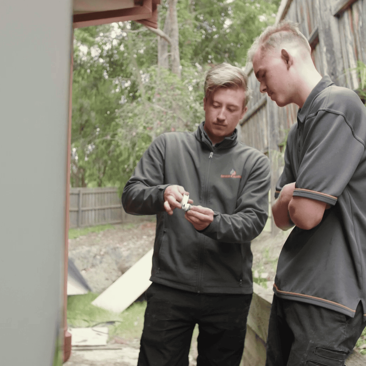 Ducted heating repairs - Maintenance personnel checking spare parts